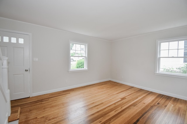145 Westminster St, Hamden, CT 06518 - empty room with ornamental molding, healthy amount of natural light, hardwood / wood-style floors, and baseboards