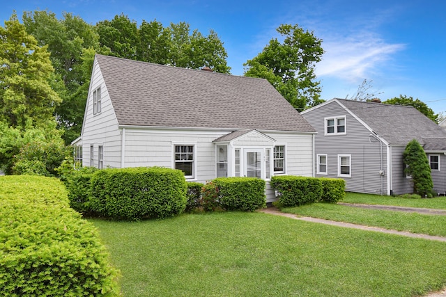145 Westminster St, Hamden, CT 06518 - cape cod home featuring a front lawn and roof with shingles