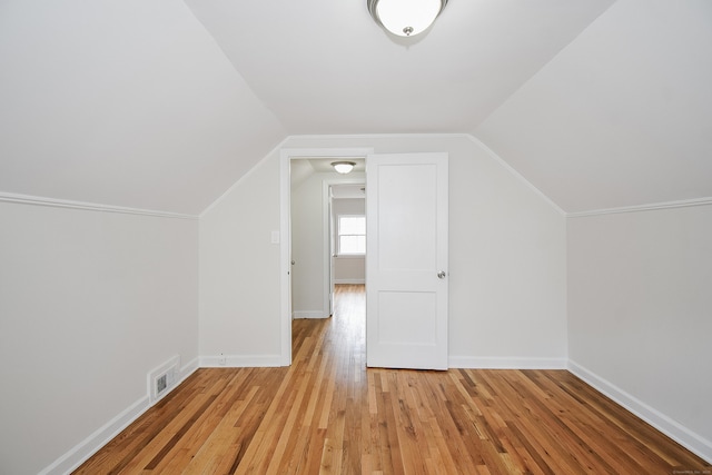 145 Westminster St, Hamden, CT 06518 - additional living space with light wood-type flooring, vaulted ceiling, and baseboards