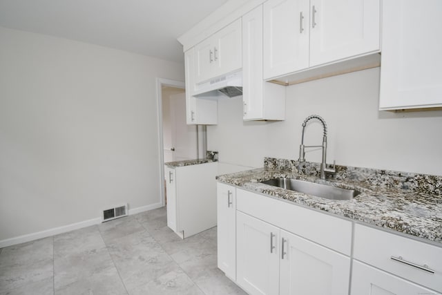 145 Westminster St, Hamden, CT 06518 - kitchen featuring a sink, under cabinet range hood, light stone counters, and white cabinets