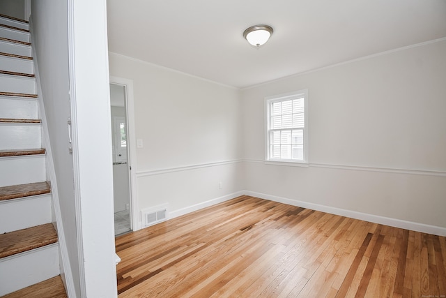 145 Westminster St, Hamden, CT 06518 - unfurnished room with stairway, crown molding, wood-type flooring, and baseboards
