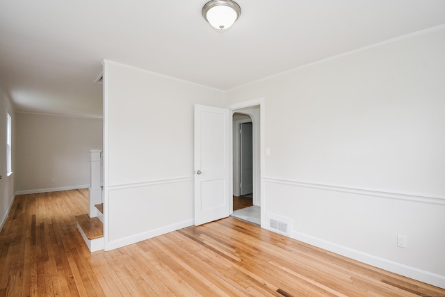 145 Westminster St, Hamden, CT 06518 - unfurnished room featuring wood-type flooring, baseboards, ornamental molding, and arched walkways
