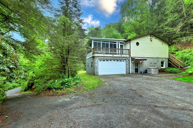 144 Punkup Rd, Oxford, CT 06478 - view of property exterior featuring driveway, stairway, a sunroom, and an attached garage