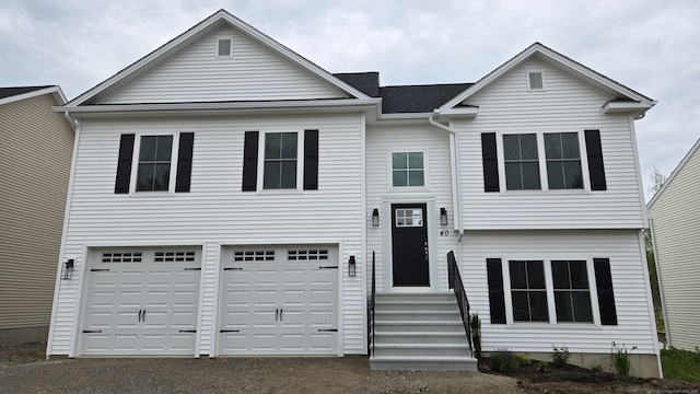 40 Yorktown Rdg, Waterbury, CT 06704 - view of front of property with a garage, asphalt driveway, and entry steps