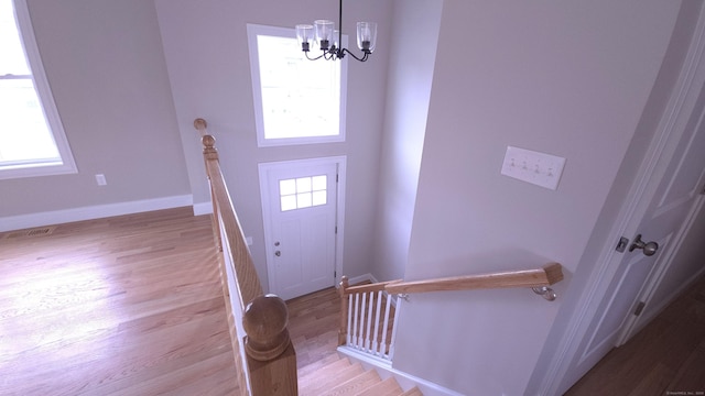 40 Yorktown Rdg, Waterbury, CT 06704 - foyer featuring light wood finished floors, a chandelier, and baseboards