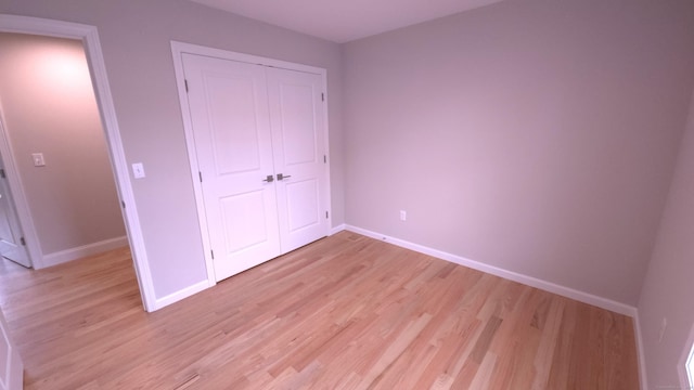 40 Yorktown Rdg, Waterbury, CT 06704 - unfurnished bedroom featuring light wood-style floors, baseboards, and a closet