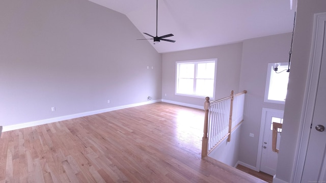 40 Yorktown Rdg, Waterbury, CT 06704 - unfurnished living room featuring ceiling fan, light wood finished floors, baseboards, and high vaulted ceiling