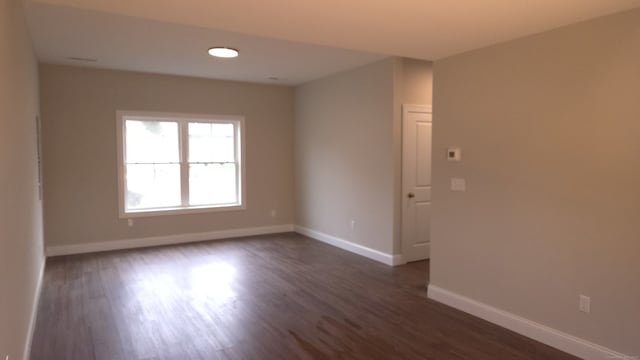 40 Yorktown Rdg, Waterbury, CT 06704 - unfurnished room featuring baseboards and dark wood finished floors