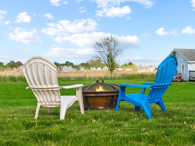 74 Chalker Beach Rd, Old Saybrook, CT 06475 - view of grassy yard with an outdoor fire pit