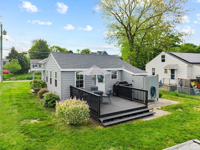 74 Chalker Beach Rd, Old Saybrook, CT 06475 - rear view of house featuring roof with shingles and a deck