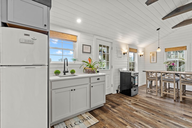 74 Chalker Beach Rd, Old Saybrook, CT 06475 - kitchen featuring freestanding refrigerator, gas range, a sink, dark wood-style flooring, and light countertops