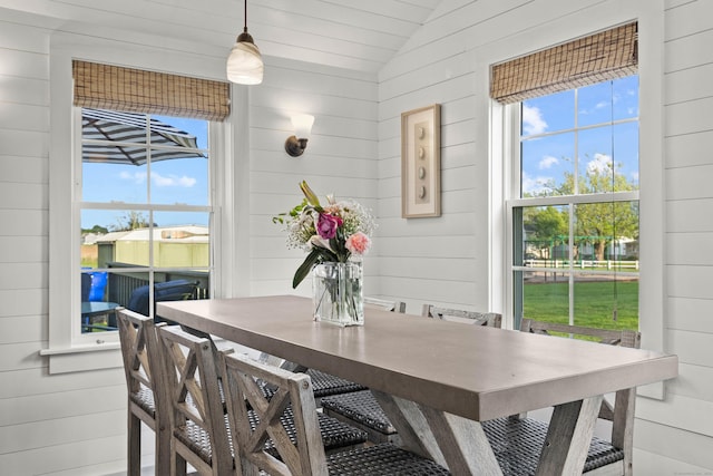 74 Chalker Beach Rd, Old Saybrook, CT 06475 - dining space featuring wood walls, healthy amount of natural light, and lofted ceiling
