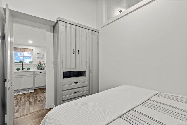 74 Chalker Beach Rd, Old Saybrook, CT 06475 - bedroom with dark wood-style floors and a sink