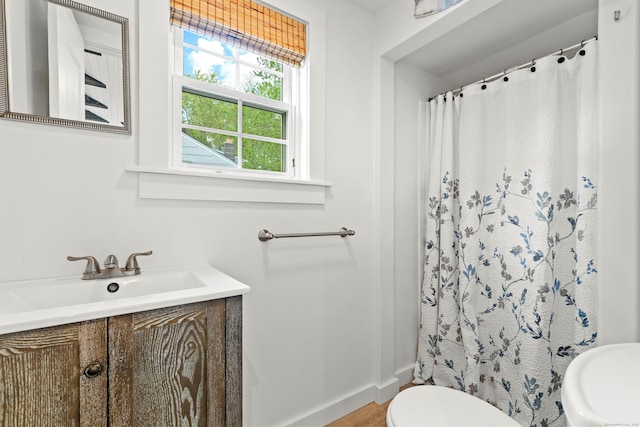 74 Chalker Beach Rd, Old Saybrook, CT 06475 - bathroom with toilet, vanity, a shower with curtain, and baseboards