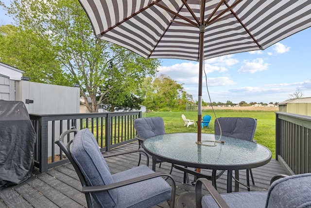74 Chalker Beach Rd, Old Saybrook, CT 06475 - wooden terrace with outdoor dining area, a yard, and grilling area