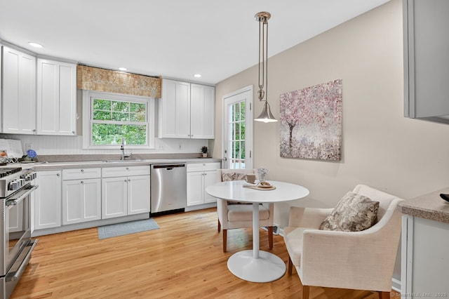 49 Bear Hills Rd, Newtown, CT 06470 - kitchen with healthy amount of natural light, appliances with stainless steel finishes, white cabinetry, light wood-style floors, and recessed lighting