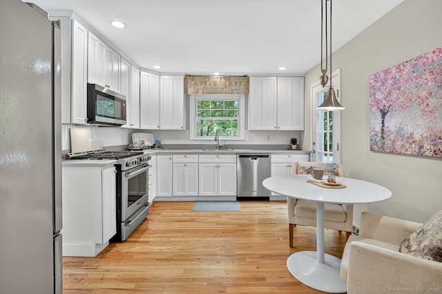49 Bear Hills Rd, Newtown, CT 06470 - kitchen featuring stainless steel appliances, light wood finished floors, white cabinetry, light countertops, and recessed lighting