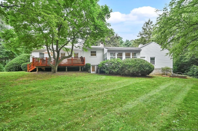 49 Bear Hills Rd, Newtown, CT 06470 - back of property with a deck, a yard, and a chimney