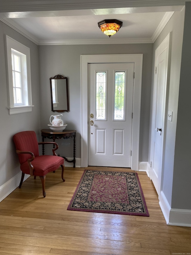 1248 Valley Rd, Fairfield, CT 06825 - foyer featuring baseboards, wood finished floors, and ornamental molding