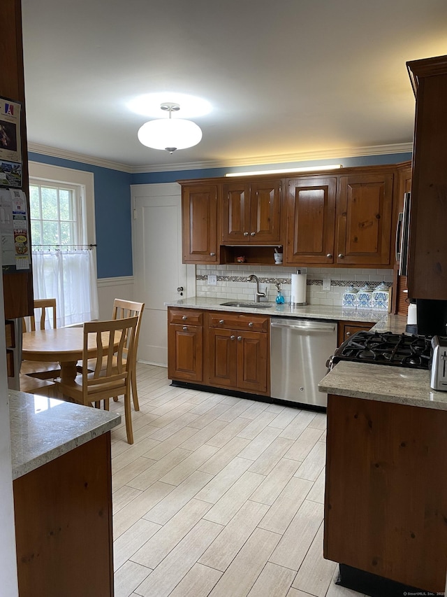 1248 Valley Rd, Fairfield, CT 06825 - kitchen with stainless steel appliances, a sink, ornamental molding, tasteful backsplash, and a wainscoted wall