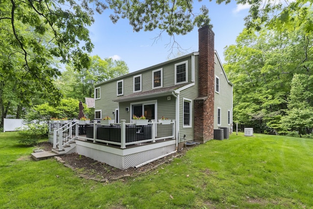 8A Russett Rd, Newtown, CT 06482 - rear view of property with a chimney, a yard, a wooden deck, and cooling unit