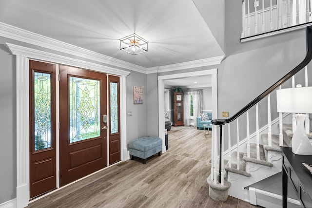 8A Russett Rd, Newtown, CT 06482 - entryway with stairs, wood finished floors, a chandelier, and crown molding