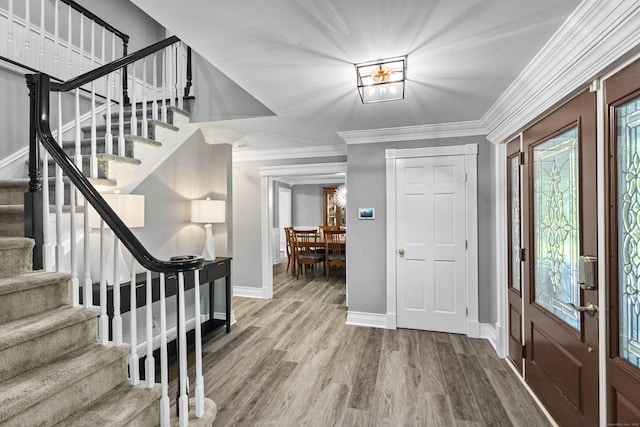 8A Russett Rd, Newtown, CT 06482 - entryway featuring stairway, baseboards, crown molding, and wood finished floors