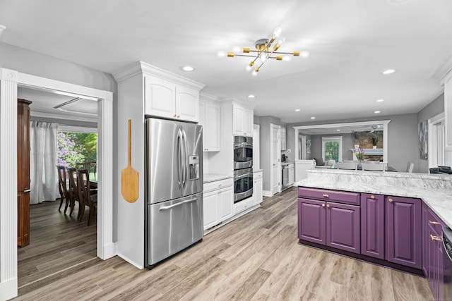 8A Russett Rd, Newtown, CT 06482 - kitchen with appliances with stainless steel finishes, a chandelier, light wood-style flooring, recessed lighting, and white cabinetry