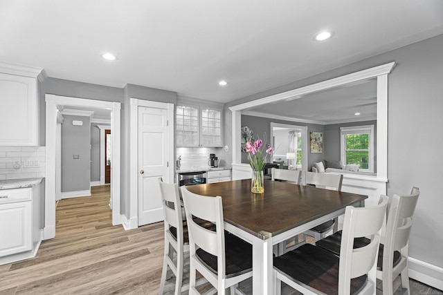 8A Russett Rd, Newtown, CT 06482 - dining area featuring a baseboard heating unit, light wood-type flooring, recessed lighting, and baseboards