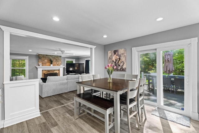 8A Russett Rd, Newtown, CT 06482 - dining room featuring light wood finished floors, a stone fireplace, recessed lighting, and ceiling fan