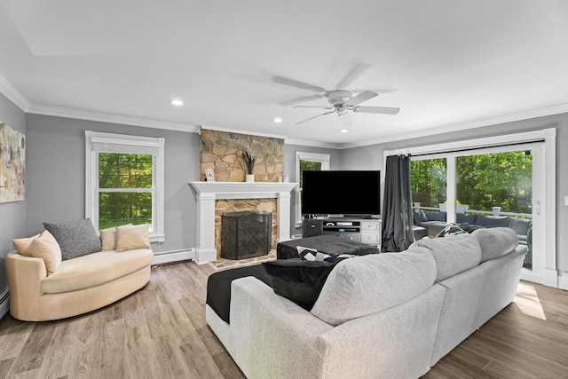 8A Russett Rd, Newtown, CT 06482 - living room with a baseboard heating unit, crown molding, plenty of natural light, ceiling fan, and wood finished floors