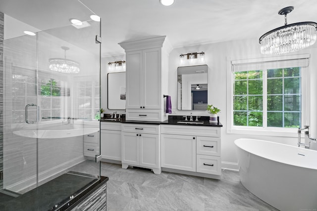 8A Russett Rd, Newtown, CT 06482 - bathroom with a chandelier, double vanity, a soaking tub, a stall shower, and marble finish flooring
