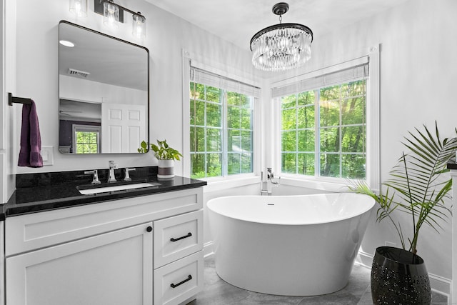8A Russett Rd, Newtown, CT 06482 - bathroom with vanity, plenty of natural light, a soaking tub, and a chandelier