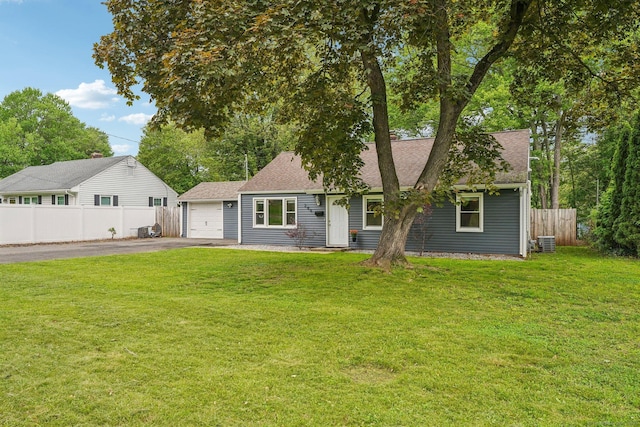 288 Robbins Ave, Newington, CT 06111 - view of front facade featuring asphalt driveway, central air condition unit, roof with shingles, and a garage