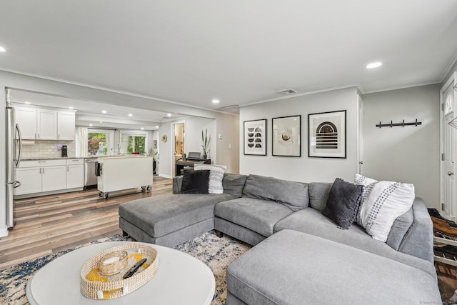 288 Robbins Ave, Newington, CT 06111 - living room with recessed lighting, light wood-style flooring, and ornamental molding
