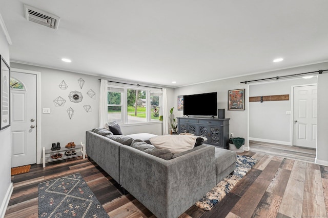 288 Robbins Ave, Newington, CT 06111 - living area featuring a barn door, ornamental molding, recessed lighting, wood finished floors, and baseboards
