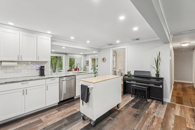 288 Robbins Ave, Newington, CT 06111 - kitchen featuring stainless steel dishwasher, white cabinets, recessed lighting, dark wood-style flooring, and ornamental molding