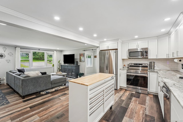 288 Robbins Ave, Newington, CT 06111 - kitchen with appliances with stainless steel finishes, butcher block countertops, open floor plan, dark wood-style flooring, and white cabinets