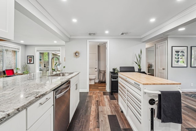 288 Robbins Ave, Newington, CT 06111 - kitchen featuring dishwasher, a sink, wooden counters, dark wood-type flooring, and recessed lighting