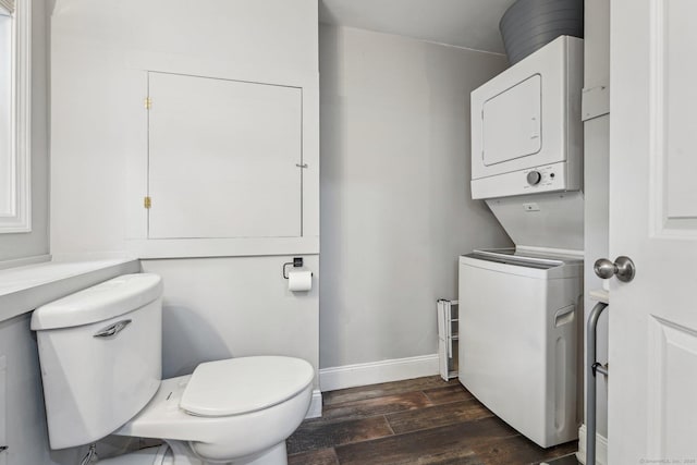 288 Robbins Ave, Newington, CT 06111 - bathroom with stacked washing machine and dryer, toilet, wood finished floors, and baseboards