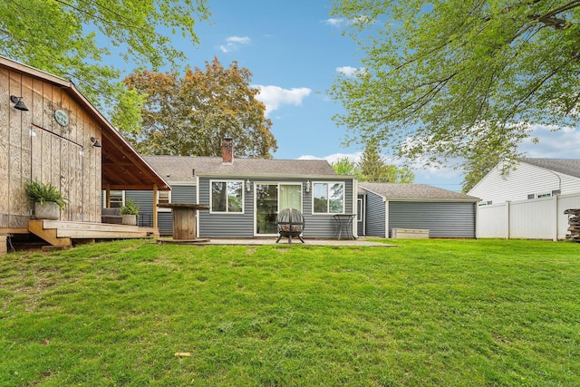 288 Robbins Ave, Newington, CT 06111 - rear view of property featuring a chimney, a shingled roof, and a patio area
