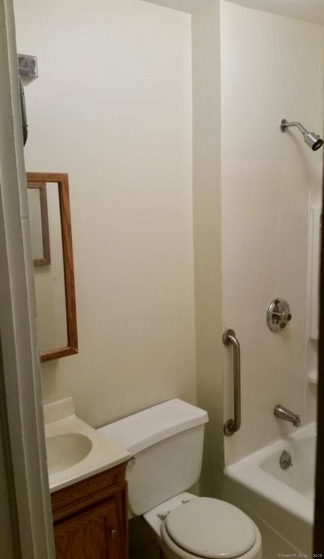 bathroom with vanity, toilet, and shower / bath combination