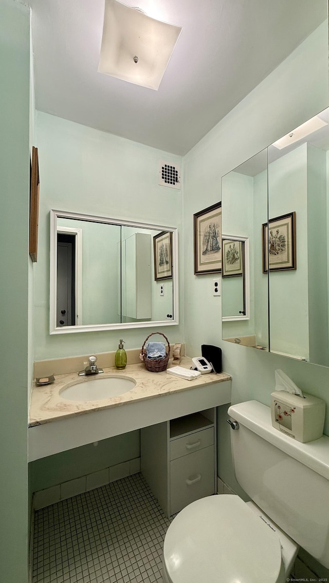 1 Strawberry Hill Ct Apt 6F, Stamford, CT 06902 - bathroom featuring toilet, tile patterned floors, and vanity