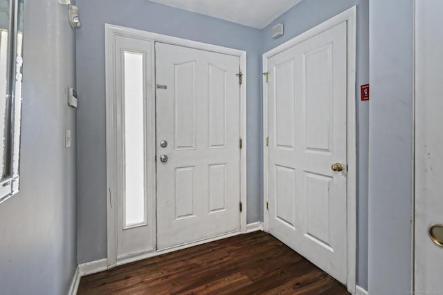 3250 Fairfield Ave Apt 302, Bridgeport, CT 06605 - foyer with dark wood-style flooring and baseboards