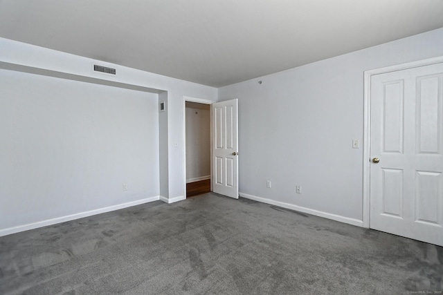 3250 Fairfield Ave Apt 302, Bridgeport, CT 06605 - unfurnished bedroom with baseboards and dark carpet