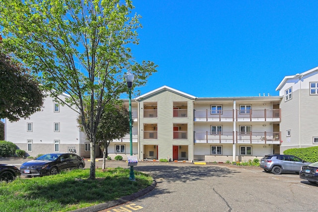 3250 Fairfield Ave Apt 302, Bridgeport, CT 06605 - view of building exterior featuring uncovered parking