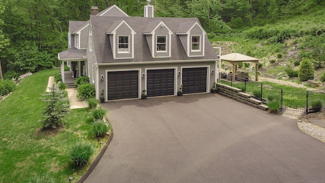 130 Wildewood Run, Bristol, CT 06010 - view of front of house with roof with shingles, a chimney, driveway, and a forest view