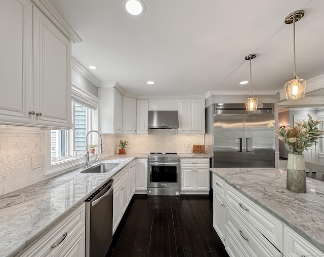 130 Wildewood Run, Bristol, CT 06010 - kitchen featuring appliances with stainless steel finishes, wall chimney range hood, a sink, white cabinets, and dark wood-style floors