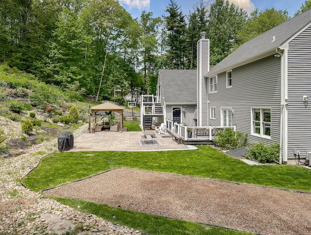 130 Wildewood Run, Bristol, CT 06010 - back of property with a deck, a patio area, a chimney, a yard, and a gazebo