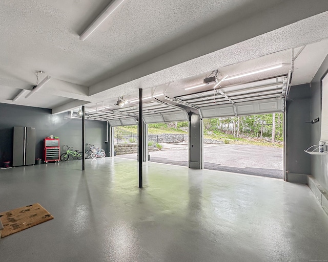 130 Wildewood Run, Bristol, CT 06010 - garage featuring a garage door opener